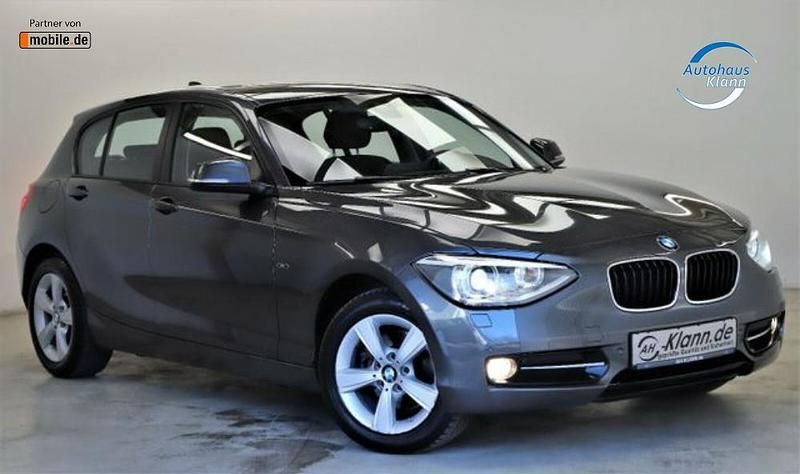 Grau Gebraucht 2014 BMW 118 Sport Line Kleinwagen | 12.499 € (Teuer) - Bild 1/4