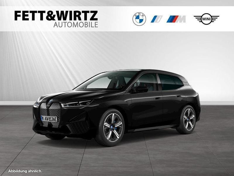 Saphirschwarz metallic Gebraucht 2024 BMW iX Sport Line SUV | 68.888 € (Guter Preis) - Bild 1/3