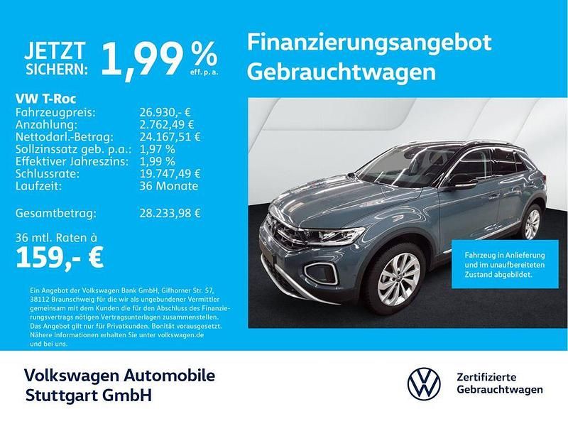 Petroleum blue metallic/schwar Gebraucht 2024 VW T-Roc Style SUV | 26.930 € (Guter Preis) - Bild 1/4