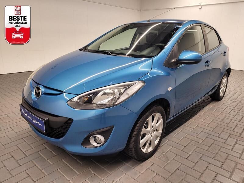 Blau (faroblaumet.) Gebraucht 2013 Mazda 2 Kleinwagen | 6.900 € (Teuer) - Bild 1/4