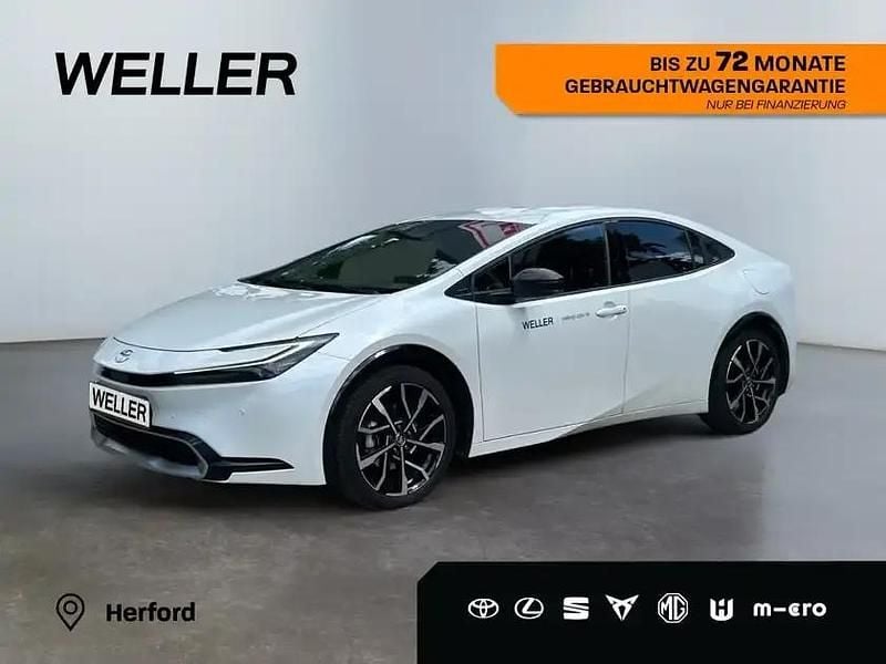 Platinumweiß perleffekt Gebraucht 2023 Toyota Prius Executive Kleinwagen | 35.690 € (Fairer Preis) - Bild 1/3