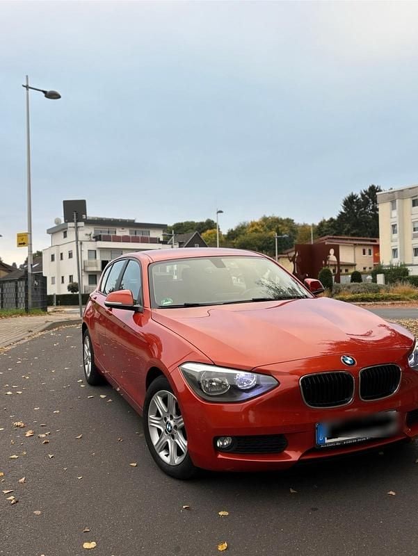 Orange Gebraucht 2012 BMW 116 M Sport Kleinwagen | 6.990 € (Superpreis) - Bild 1/4