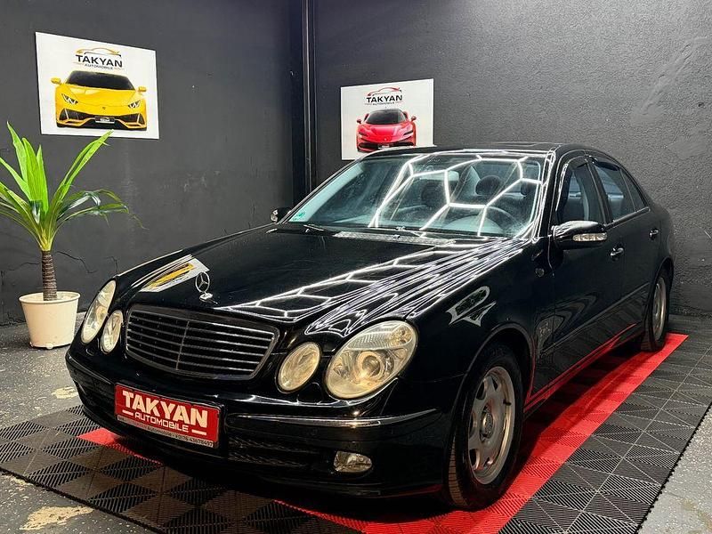 Second-hand Mercedes E200 163 CP (119 kW) 2003 Negru Berlinǎ