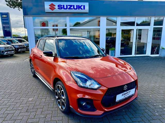 Flame orange / super black Gebraucht 2024 Suzuki Swift Sport Limousine | 19.900 € - Bild 1/4
