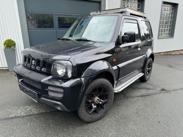 Schwarz Gebraucht 2009 Suzuki Jimny Club SUV | 9.490 € (Teuer) - Bild 1/4