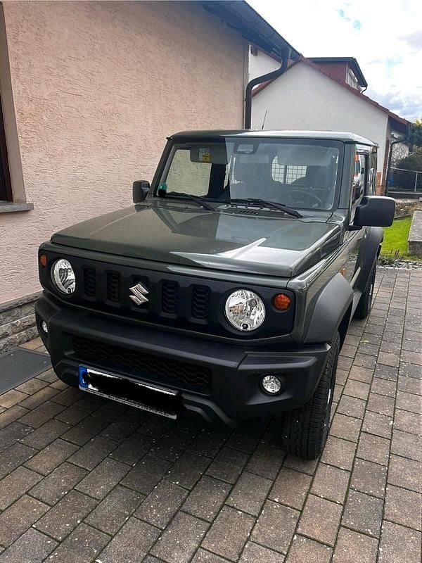 Grün Gebraucht 2023 Suzuki Jimny Comfort SUV | 28.500 € (Guter Preis) - Bild 1/4