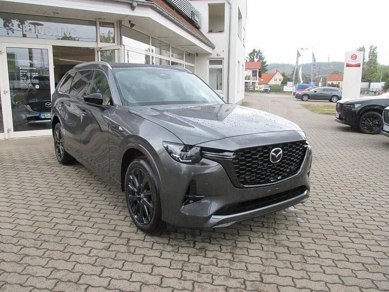 Machine gray Neu 2025 Mazda CX-80 Homura-Line SUV | 63.749 € (Etwas zu teuer) - Bild 1/4