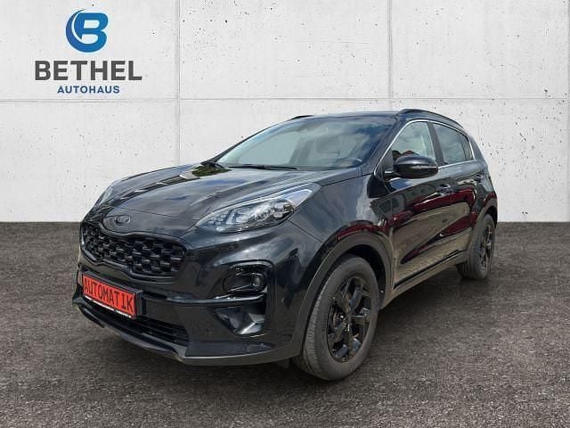 Zilinaschwarz met. (metallic) Gebraucht 2021 Kia Sportage SUV | 23.990 € (Fairer Preis) - Bild 1/4