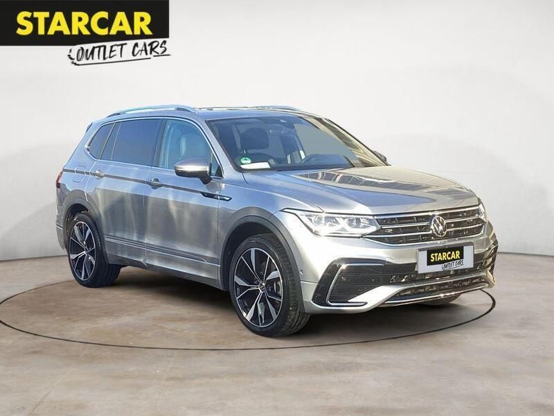 Pyritsilber metallic Gebraucht 2024 VW Tiguan Allspace R-line Plus SUV | 51.970 € (Teuer) - Bild 1/4