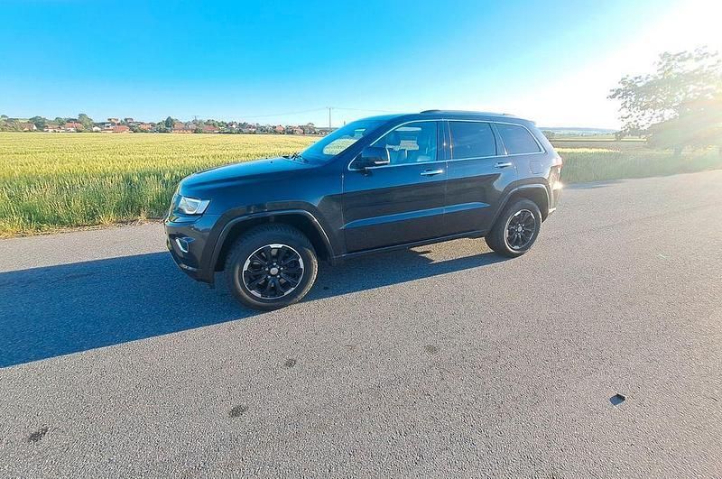 Grau Gebraucht 2015 Jeep Grand Cherokee Overland SUV | 19.800 € (Fairer Preis) - Bild 1/4