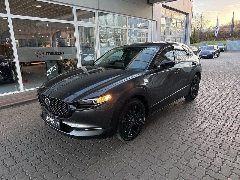 Machine gray (metallic) Gebraucht 2024 Mazda CX-30 Nagisa SUV | 27.990 € (Fairer Preis) - Bild 1/4