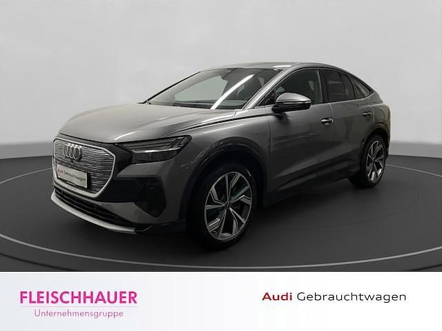 Taifungrau metallic Gebraucht 2023 Audi Q4 Sportback e-tron Ambiente SUV | 31.890 € (Guter Preis) - Bild 1/4