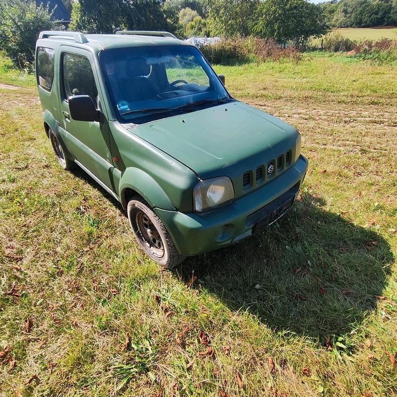 Grün Gebraucht 1999 Suzuki Jimny SUV | 1.850 € - Bild 1/4