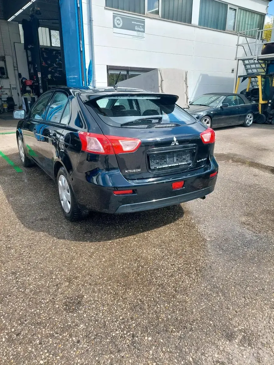 Second-hand Mitsubishi Lancer 109 CP (80 kW) 2010 Negru Berlinǎ