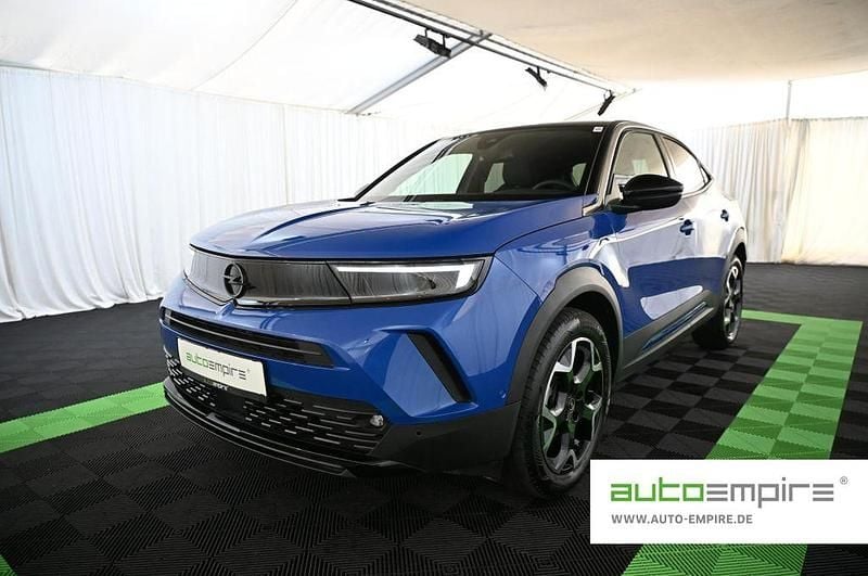 Voltaik blau Gebraucht 2024 Opel Mokka Ultimate SUV | 18.290 € (Superpreis) - Bild 1/3