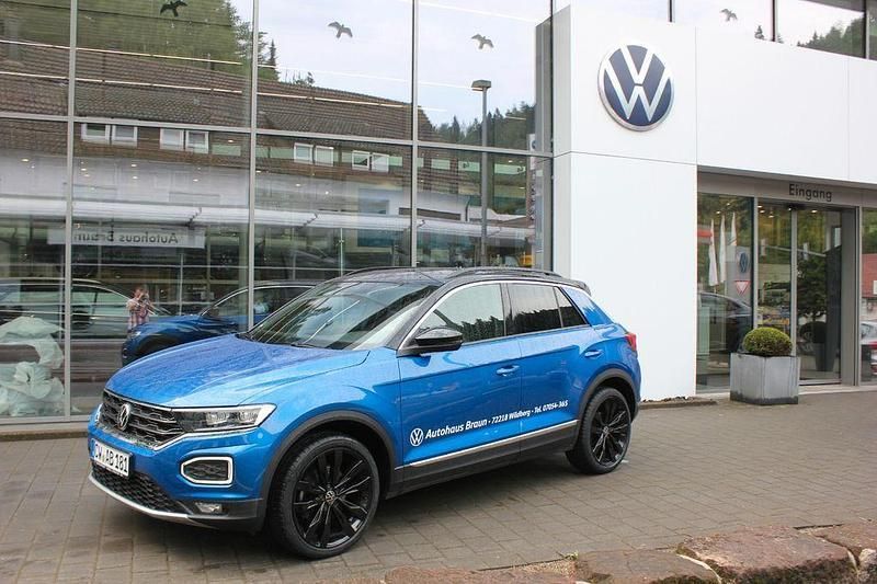 Ravennablau metallic Gebraucht 2021 VW T-Roc Sportline SUV | 27.690 € (Fairer Preis) - Bild 1/4