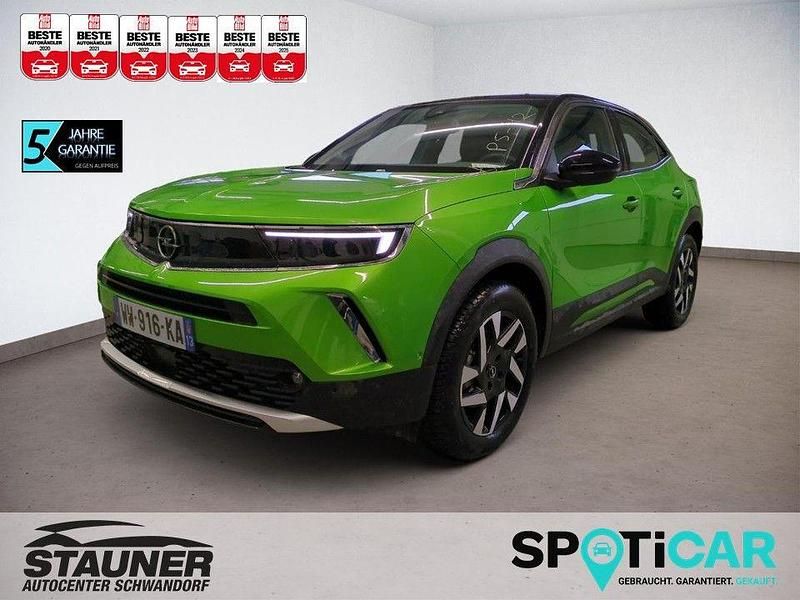 Grün Gebraucht 2023 Opel Mokka-e Elegance SUV | 16.580 € (Superpreis) - Bild 1/4