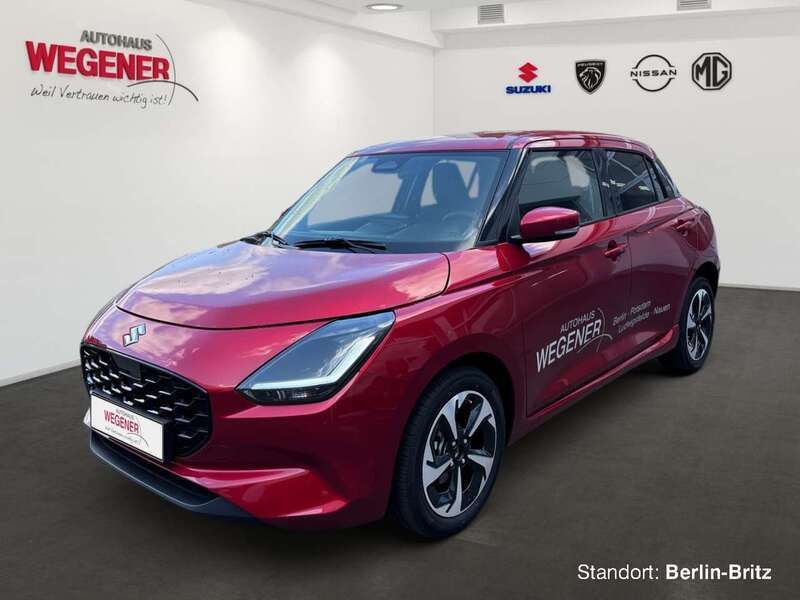 Burning red pearl metallic Gebraucht 2025 Suzuki Swift Comfort+ Kleinwagen | 22.950 € - Bild 1/4