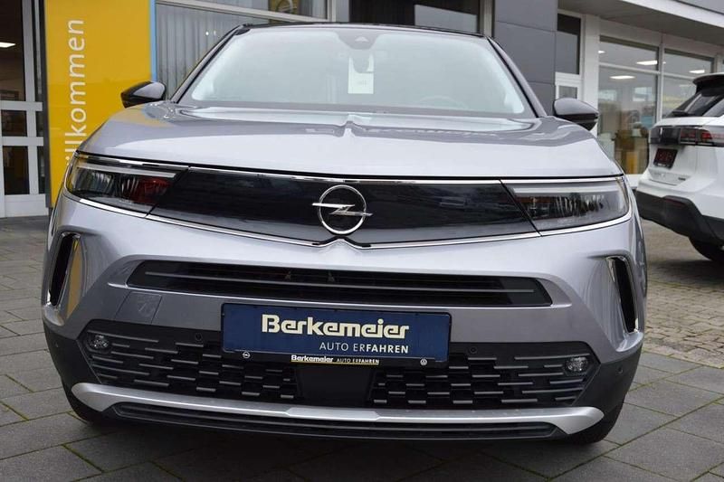 Gebraucht Opel Mokka-e Elegance 100 kW (136 PS) 2022 Kontrast grauquarz silber (metallic) SUV