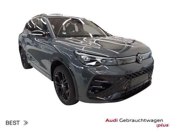 Delfingrau metallic (metallic) Gebraucht 2025 VW Tiguan R-line SUV | 48.449 € (Fairer Preis) - Bild 1/4
