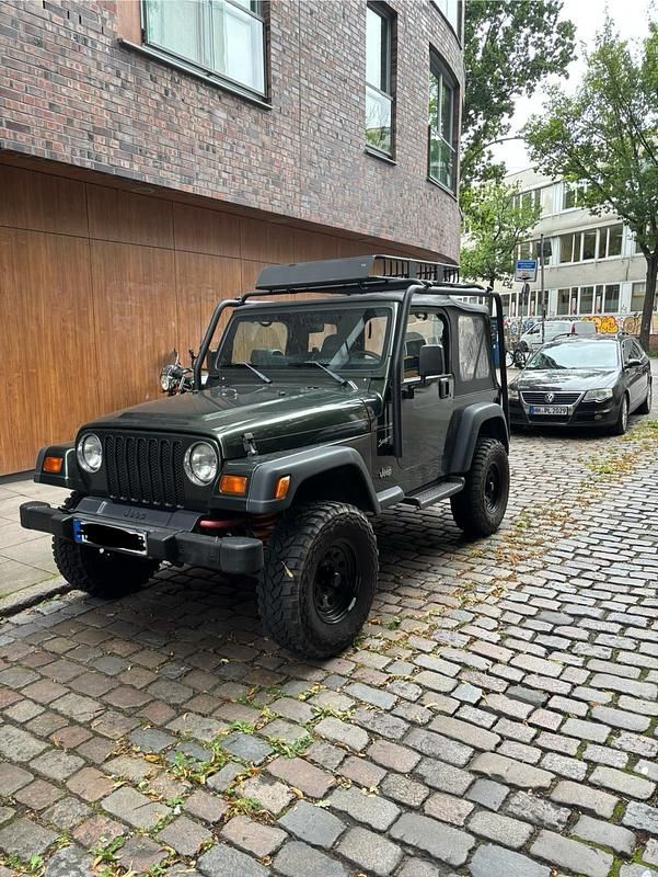 Grün Gebraucht 1998 Jeep Wrangler SUV | 14.500 € - Bild 1/4