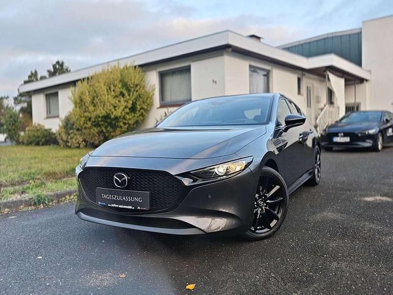 Machine gray Gebraucht 2024 Mazda 3 Homura-Line Limousine | 26.890 € (Fairer Preis) - Bild 1/4