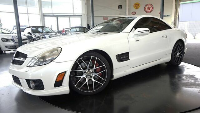 Weiß metallic Gebraucht 2009 Mercedes SL63 AMG AMG Cabrio | 34.722 € (Guter Preis) - Bild 1/4