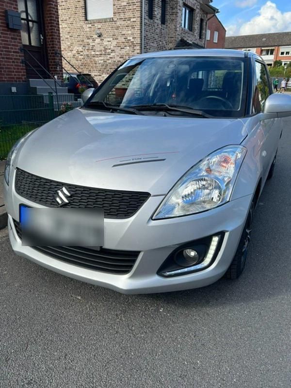 Grau Gebraucht 2016 Suzuki Swift Limousine | 6.199 € (Guter Preis) - Bild 1/4
