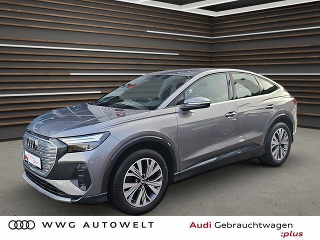 Taifungrau metallic Gebraucht 2021 Audi Q4 Sportback e-tron Ambiente SUV | 23.230 € (Fairer Preis) - Bild 1/4