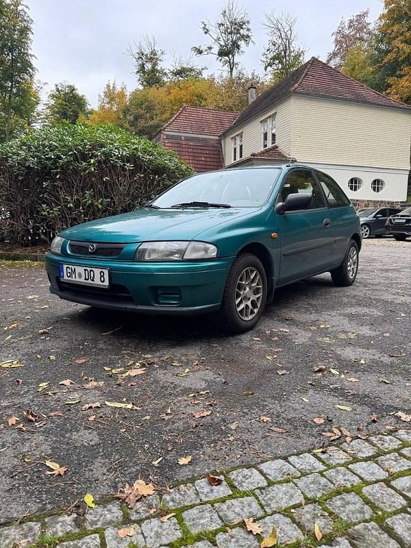 Grün Gebraucht 1998 Mazda 323F Kleinwagen | 850 € - Bild 1/4