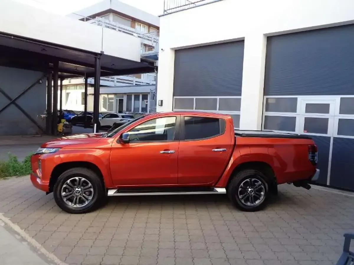 Gebraucht Mitsubishi L200 Top 150 PS (110 kW) 2021 Zirkonorange Pickup