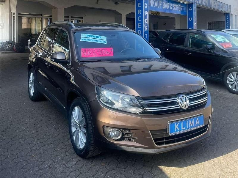 Toffeebraun metallic Gebraucht 2014 VW Tiguan Cup SUV | 13.300 € (Fairer Preis) - Bild 1/4
