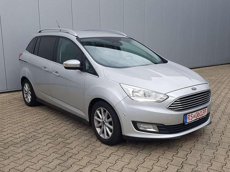 Grau Gebraucht 2016 Ford Grand C-Max Business Edition Van / Kleinbus | 8.999 € (Fairer Preis) - Bild 1/4