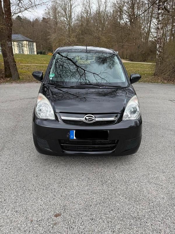 Gebraucht Daihatsu Cuore 69 PS (50 kW) 2008 Schwarz Kleinwagen