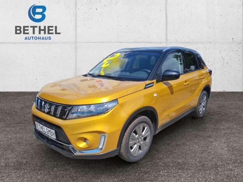 Solar yellow pearl metallic / Neu 2024 Suzuki Vitara Comfort SUV | 25.000 € (Superpreis) - Bild 1/4