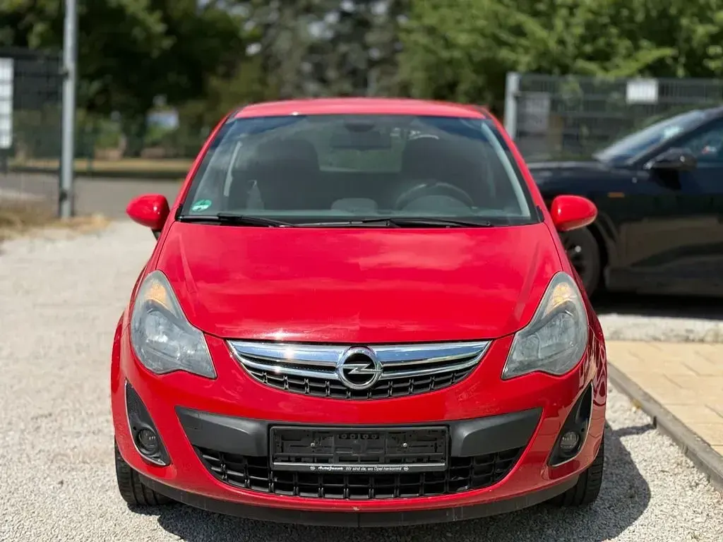 Gebraucht Opel Corsa Active 95 PS (69 kW) 2013 Magmarot/flame red Kleinwagen