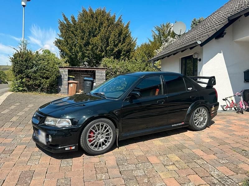 Second-hand Mitsubishi Lancer Evolution 300 CP (220 kW) 2000 Negru Berlinǎ