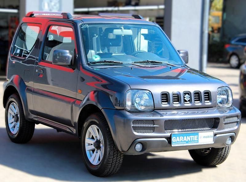 Grau Gebraucht 2011 Suzuki Jimny Style SUV | 11.990 € (Fairer Preis) - Bild 1/4