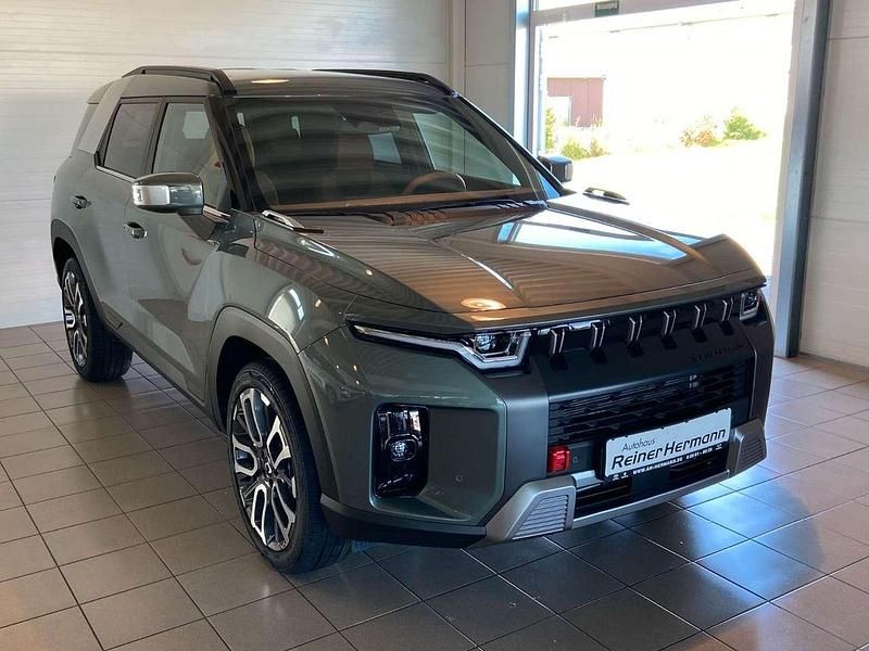 Forrest green metallic Gebraucht 2023 Ssangyong Torres SUV | 32.880 € - Bild 1/4