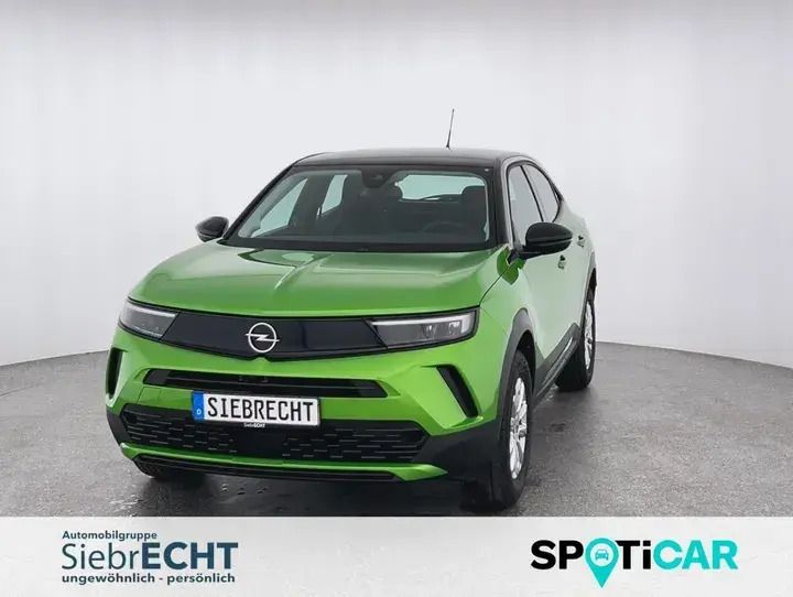 Grã¼n Gebraucht 2024 Opel Mokka Enjoy SUV | 22.490 € (Fairer Preis) - Bild 1/4