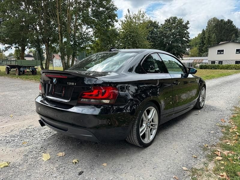 Schwarz Gebraucht 2010 BMW 135 Coupé M Sport Coupé | 14.500 € - Bild 1/4