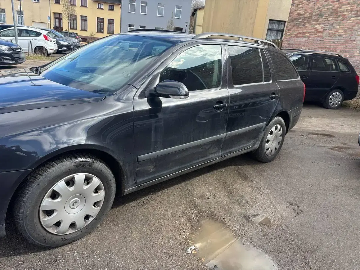 Używany Skoda Octavia 102 KM (75 kW) 2004 Czarny Kombi