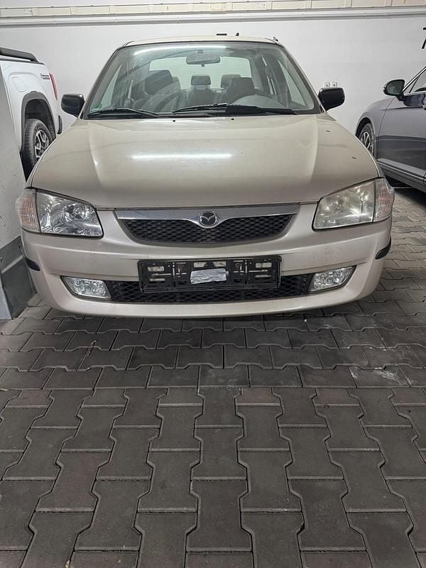 Braun Gebraucht 1999 Mazda 323 Limousine | 1.400 € (Fairer Preis) - Bild 1/4