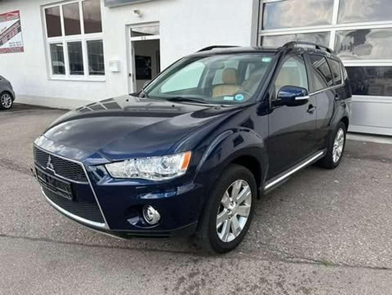 Tansanitblau (p) Gebraucht 2012 Mitsubishi Outlander Motion SUV | 9.880 € (Teuer) - Bild 1/4
