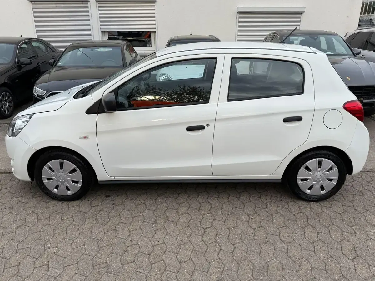 Gebraucht Mitsubishi Space Star Basis 71 PS (52 kW) 2015 Weiß Kleinwagen