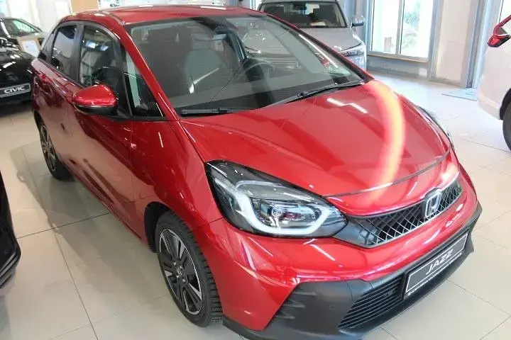 Gebraucht Honda Jazz Advance 122 PS (89 kW) 2024 Premium crystal red metallic (metallic) Kleinwagen