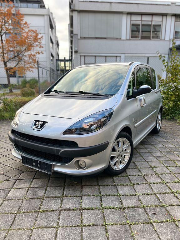 Gris aluminium Gebraucht 2008 Peugeot 1007 Premium Kleinwagen | 1.989 € (Fairer Preis) - Bild 1/4
