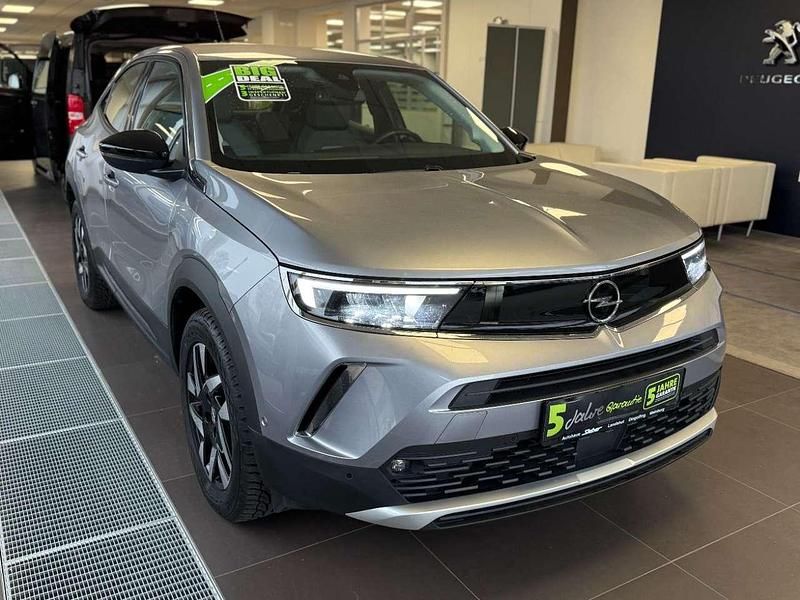 Gebraucht Opel Mokka Elegance 101 PS (74 kW) 2023 Kontrast grau/quarz silber SUV