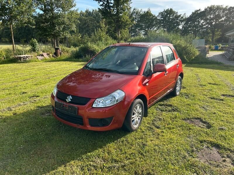 Orange Gebraucht 2008 Suzuki SX4 Limousine | 4.250 € (Fairer Preis) - Bild 1/4