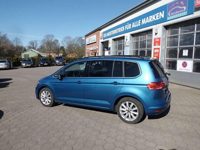 Caribbean blue metallic Gebraucht 2021 VW Touran Highline Van / Kleinbus | 26.299 € (Superpreis) - Bild 1/4